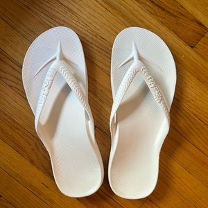 Archie’s White Flip Flops